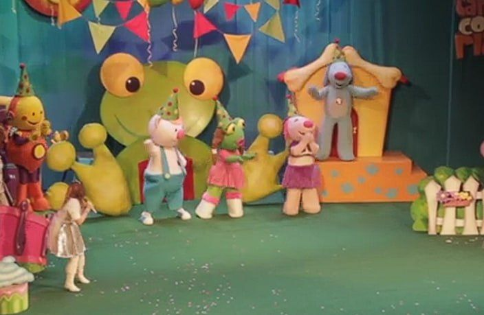 Cholito with the full Sapo Pepe supporting cast at a stage party scene